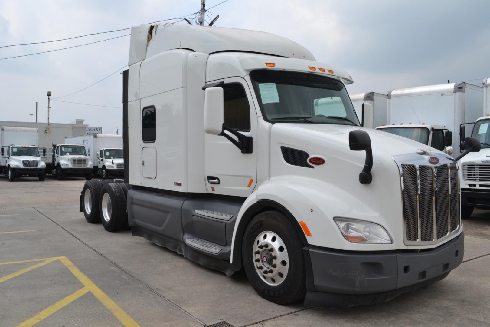 2017 WHITE /BLACK PETERBILT 579 EPIQ with an PACCAR MX13 12.9L 455HP engine, E.FULLER ADVANTAGE 10SPD AUTOMATED transmission, located at 9172 North Fwy, Houston, TX, 77037, (713) 910-6868, 29.887470, -95.411903 - 65" MID ROOF SLEEPER, DOUBLE BUNK, AIR SLIDE 5TH WHEEL, DIFF LOCK, AIR RIDE, ENGINE BRAKE, ELECTRIC APU, BUILT-IN NAVIGATION, MINI FRIDGE, ALUMINUM WHEELS, POWER WINDOWS , LOCKS, & MIRRORS, DUAL 135 GALLON FUEL TANKS, WB:230", RATIO: 2.64 - Photo#2